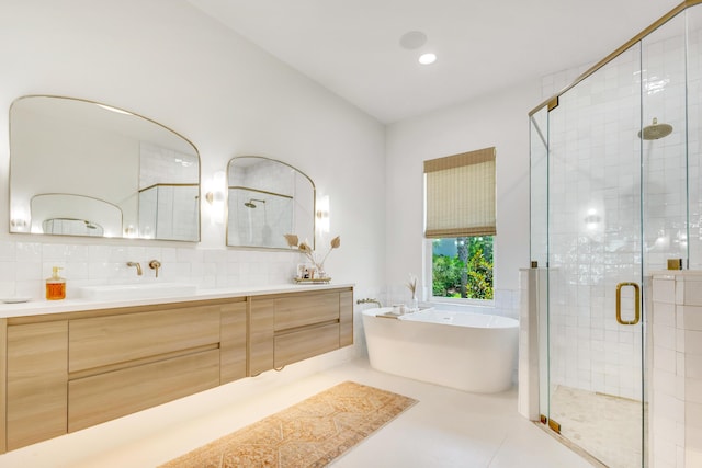 bathroom featuring vanity, shower with separate bathtub, tile patterned flooring, and decorative backsplash