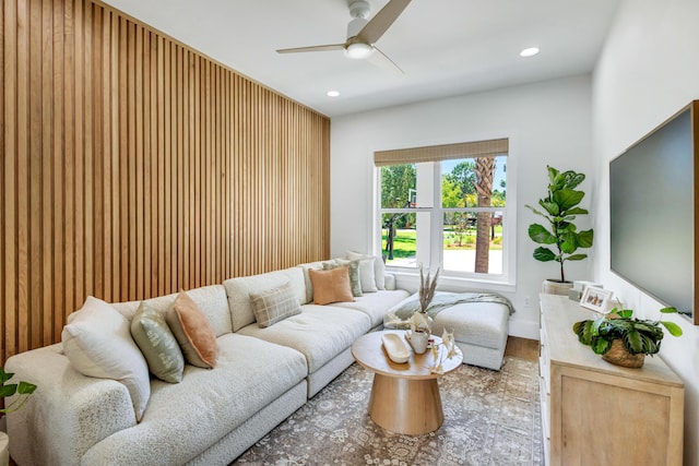 living room with ceiling fan and hardwood / wood-style floors