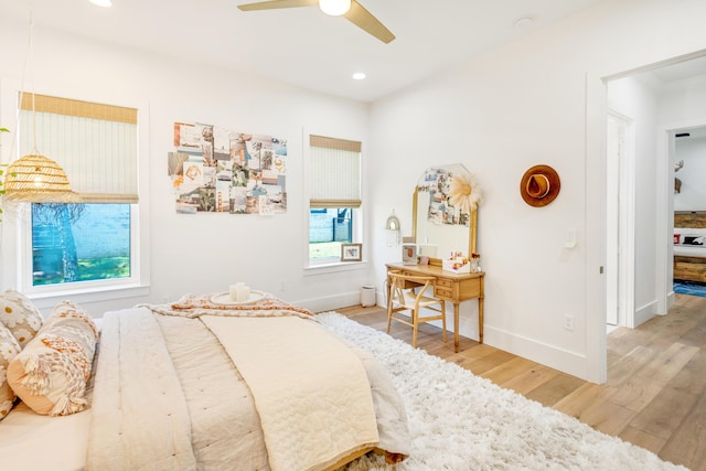 bedroom featuring ceiling fan and light hardwood / wood-style floors