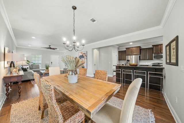 dining area with ornamental molding, dark hardwood / wood-style floors, and ceiling fan with notable chandelier