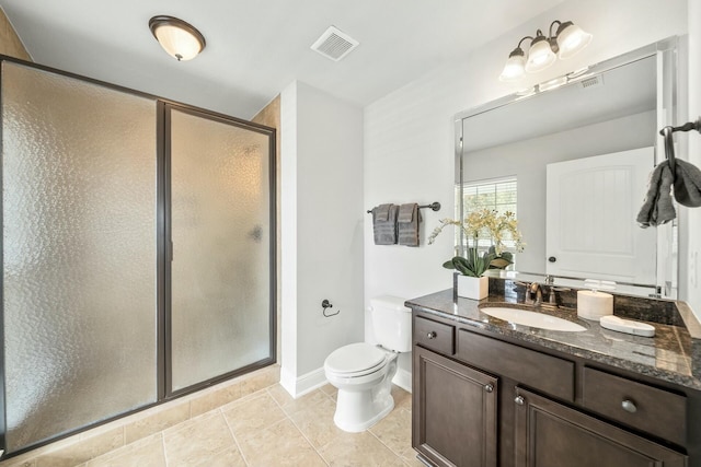 bathroom featuring vanity, an enclosed shower, tile patterned floors, and toilet