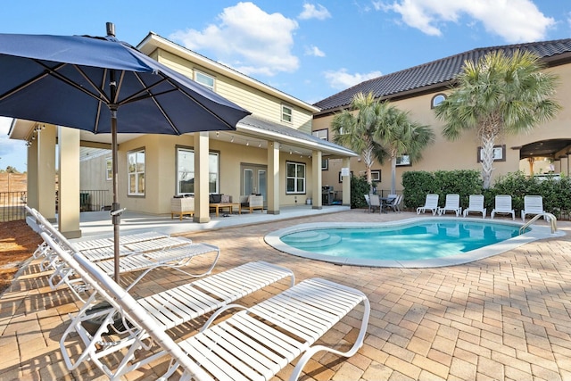 view of swimming pool with a patio