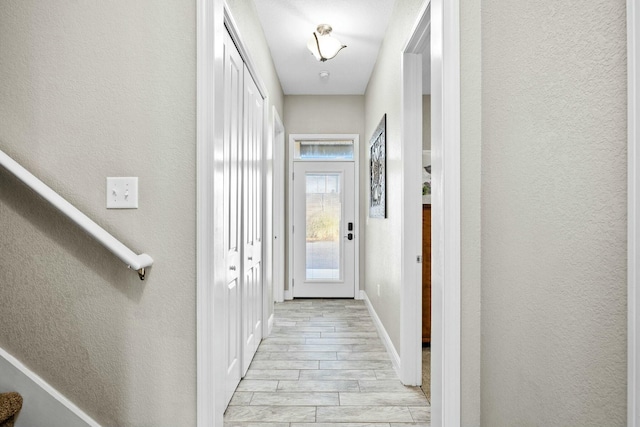 hall with light hardwood / wood-style floors