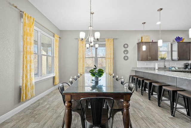 dining room featuring plenty of natural light and light wood-type flooring