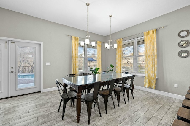 dining space with a notable chandelier