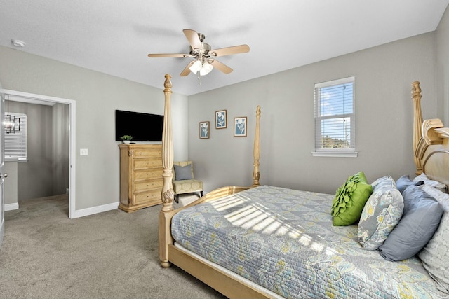 bedroom featuring light carpet and ceiling fan