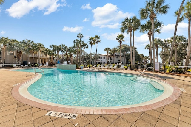 view of swimming pool featuring a patio area