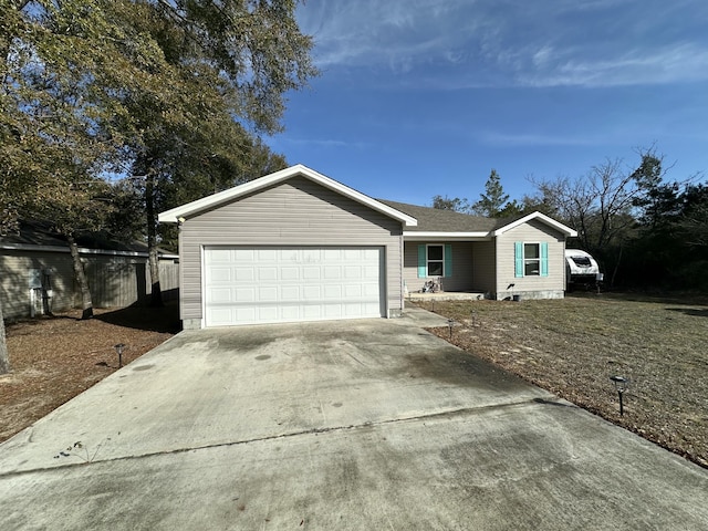 ranch-style house featuring a garage