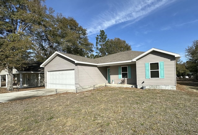 view of front of house featuring a garage and a front yard