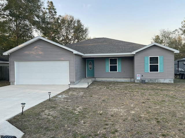 single story home featuring an attached garage, a shingled roof, and concrete driveway