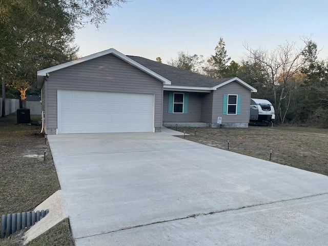 ranch-style home with cooling unit, a garage, fence, driveway, and roof with shingles