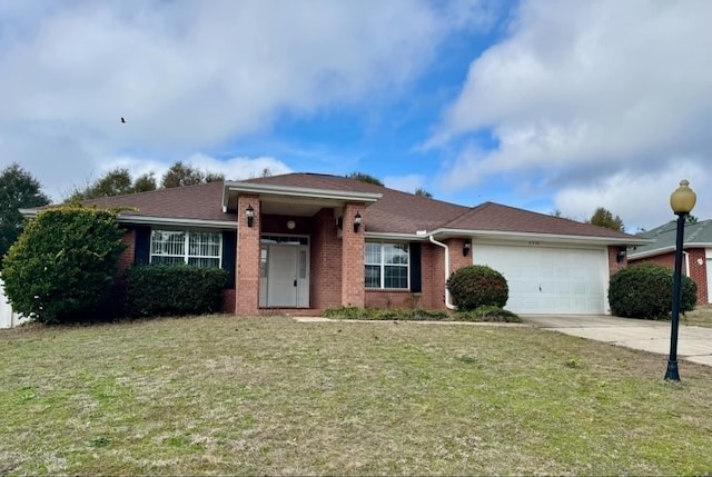 ranch-style home with an attached garage, brick siding, driveway, and a front yard