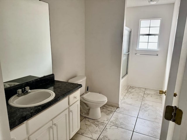 full bathroom featuring baseboards, bath / shower combo with glass door, toilet, marble finish floor, and vanity