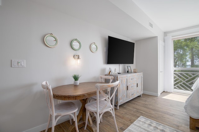 dining area with light wood-type flooring