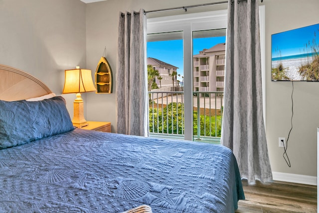 bedroom with hardwood / wood-style floors