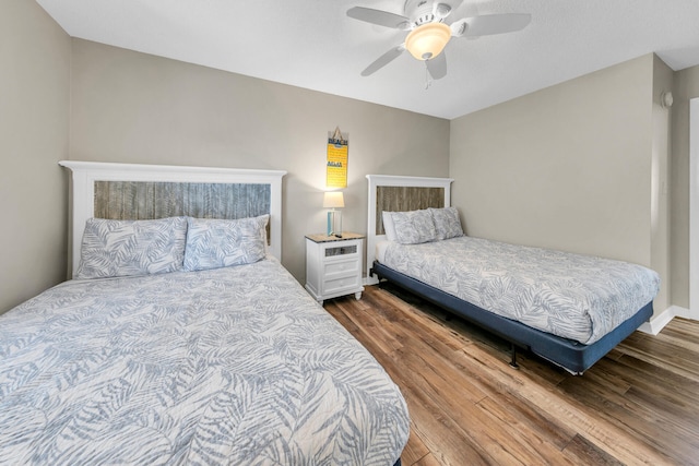 bedroom featuring hardwood / wood-style flooring and ceiling fan