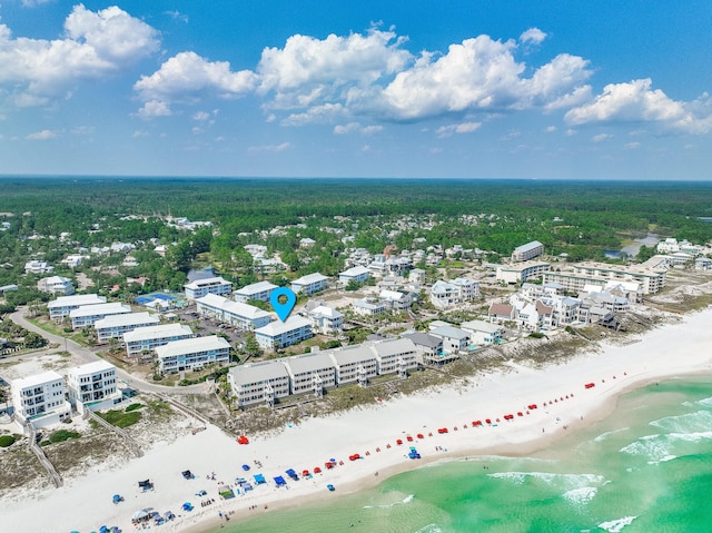 drone / aerial view with a beach view and a water view