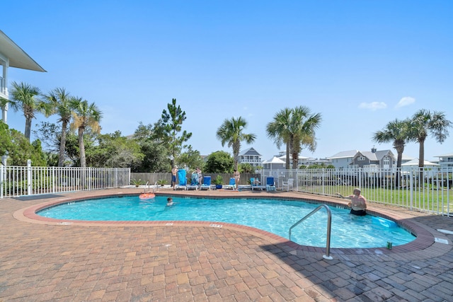 view of swimming pool with a patio area