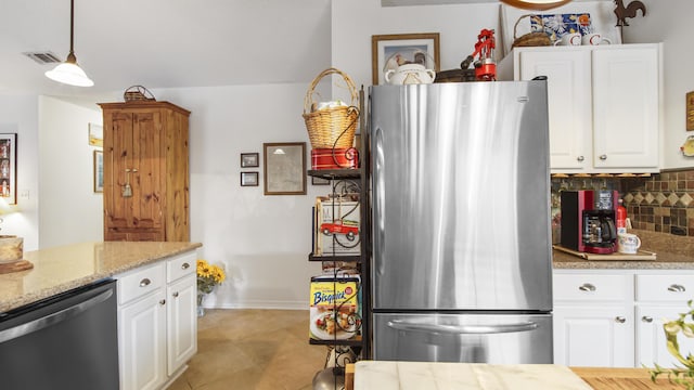 kitchen with stainless steel appliances, white cabinetry, tasteful backsplash, and decorative light fixtures