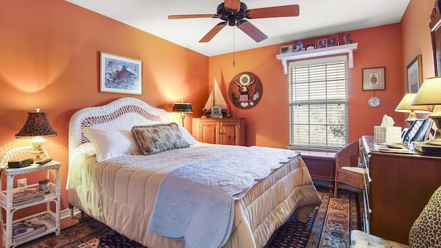 bedroom featuring ceiling fan and dark hardwood / wood-style flooring