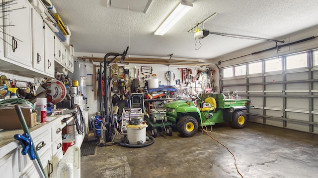 garage with a garage door opener and a workshop area