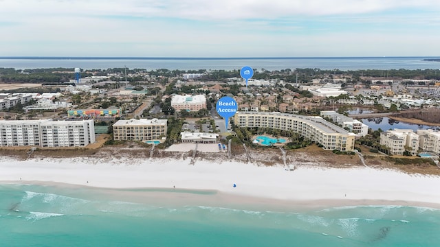 aerial view with a water view and a view of the beach