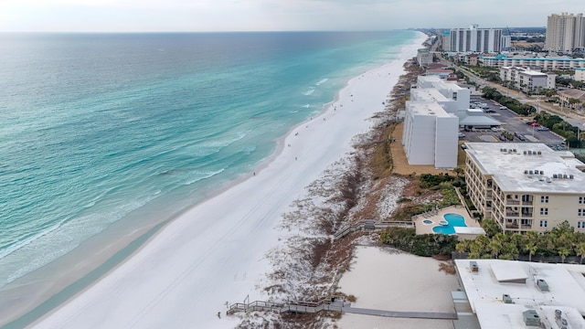 drone / aerial view featuring a water view and a view of the beach