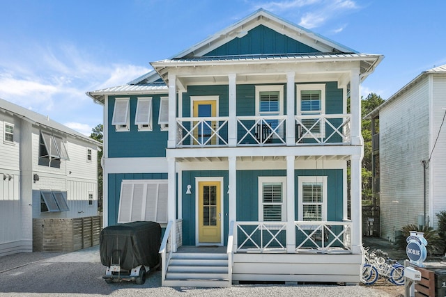 view of front of house featuring a balcony and a porch