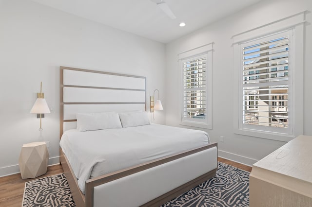 bedroom featuring hardwood / wood-style flooring and ceiling fan