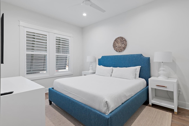 bedroom featuring hardwood / wood-style flooring and ceiling fan