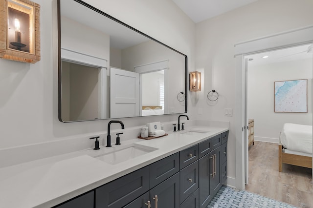 bathroom with vanity and hardwood / wood-style flooring