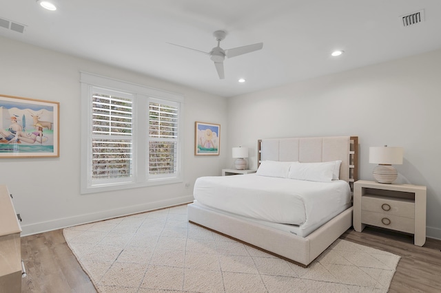 bedroom featuring ceiling fan and light hardwood / wood-style flooring