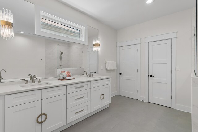 bathroom featuring walk in shower and vanity