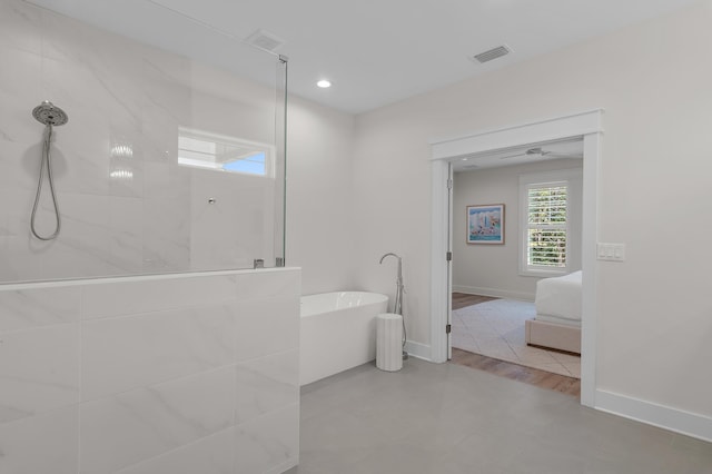 bathroom featuring separate shower and tub