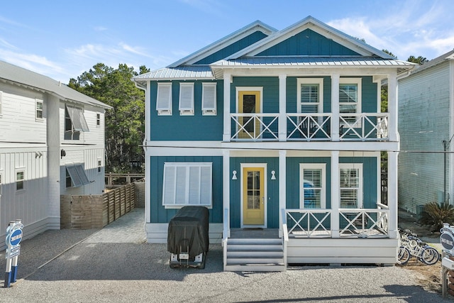 view of front of home with a balcony and a porch