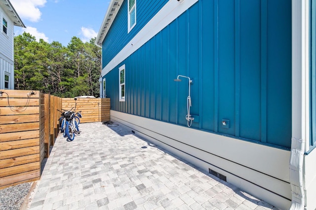 view of side of home with a patio