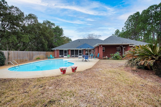6568 Castlewood St, Navarre, FL 32566 - view of swimming pool with a patio and a yard