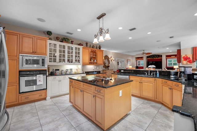 6568 Castlewood St, Navarre, FL 32566 - kitchen with sink, a center island, appliances with stainless steel finishes, kitchen peninsula, and pendant lighting