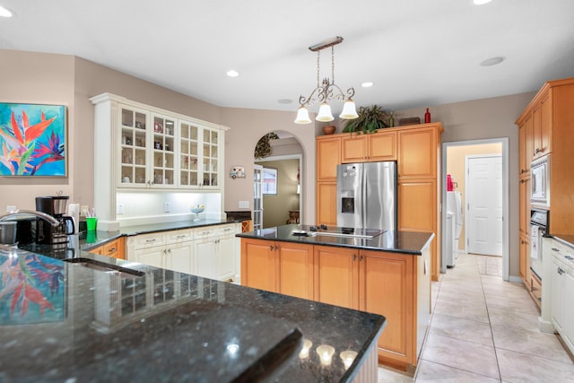 6568 Castlewood St, Navarre, FL 32566 - kitchen featuring sink, a kitchen island, stainless steel appliances, light tile patterned flooring, and decorative light fixtures
