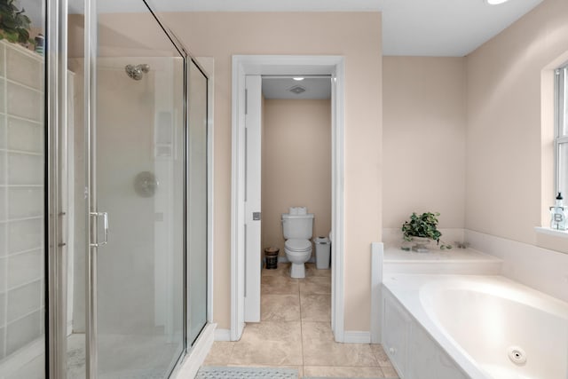 6568 Castlewood St, Navarre, FL 32566 - bathroom featuring tile patterned flooring, separate shower and tub, and toilet
