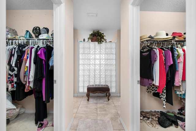 6568 Castlewood St, Navarre, FL 32566 - spacious closet featuring light tile patterned flooring