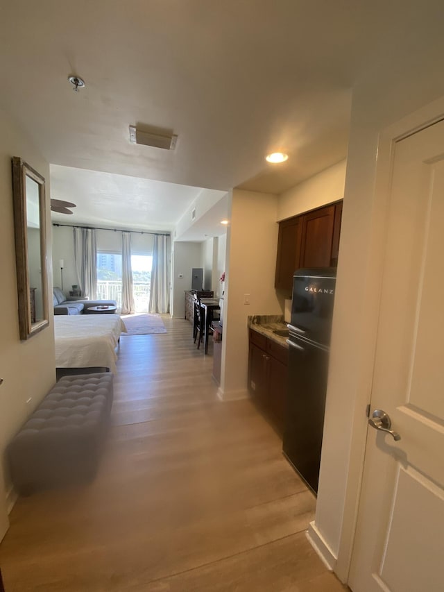 hallway featuring light hardwood / wood-style flooring