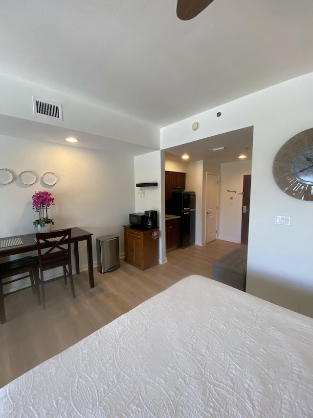 bedroom with light hardwood / wood-style floors