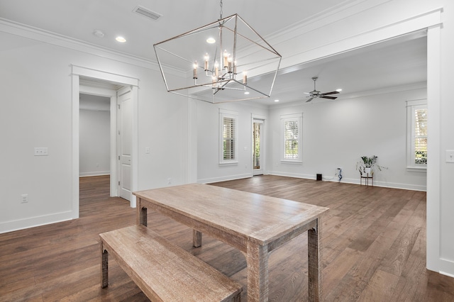 dining area with ornamental molding, dark hardwood / wood-style floors, and ceiling fan with notable chandelier