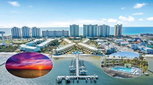 bird's eye view featuring a water view and a city view