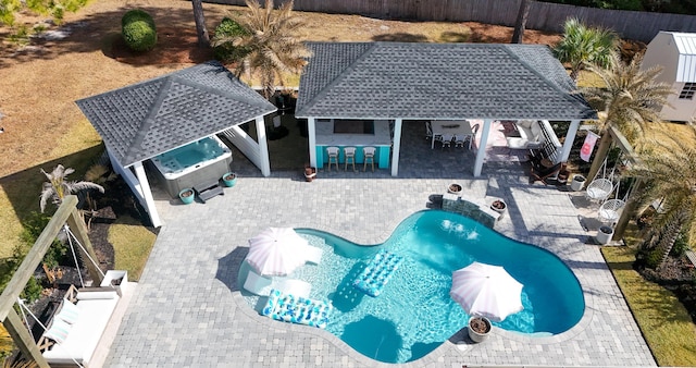 view of swimming pool with a gazebo, a patio area, and an outdoor bar