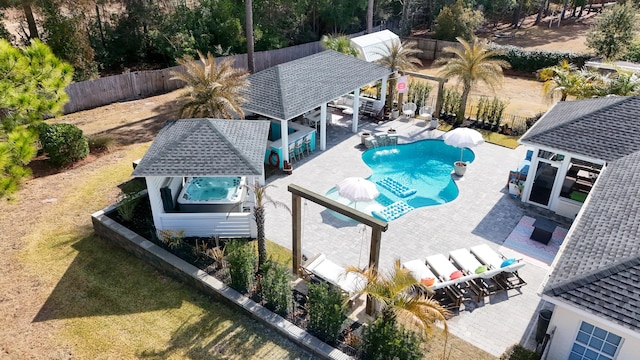 view of swimming pool with a gazebo, exterior bar, and a patio area