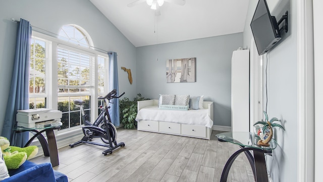 bedroom featuring lofted ceiling, light hardwood / wood-style flooring, and ceiling fan