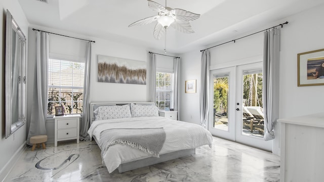 bedroom featuring multiple windows, access to outside, french doors, and ceiling fan