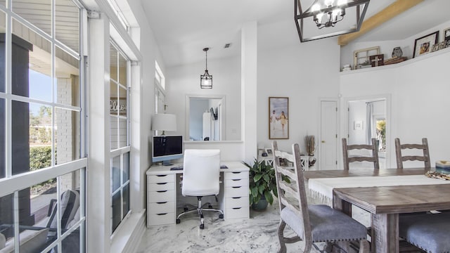 home office featuring a towering ceiling